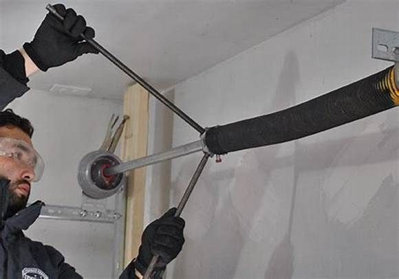 Broken garage door torsion spring